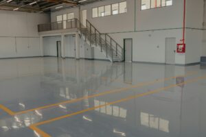 Epoxy and waxed flooring with colorful signage.